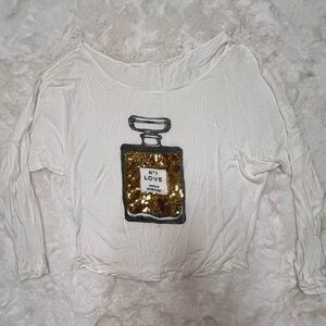 Sequin Perfume long sleeve white tee.
